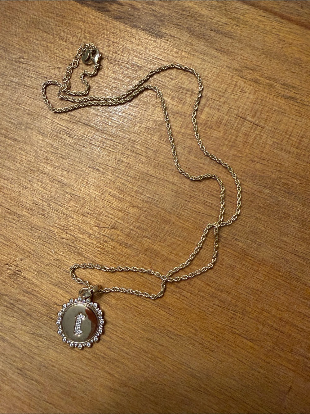 Gold “t” necklace